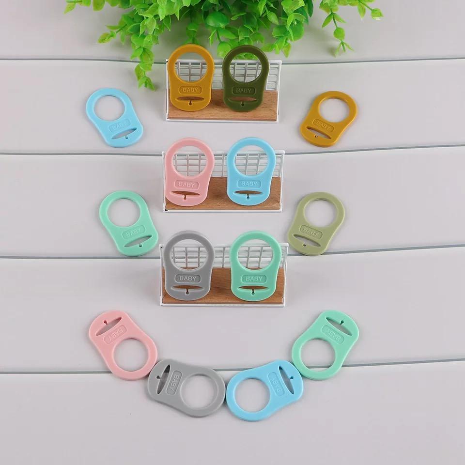 Clip adaptador de chupetas em silicone