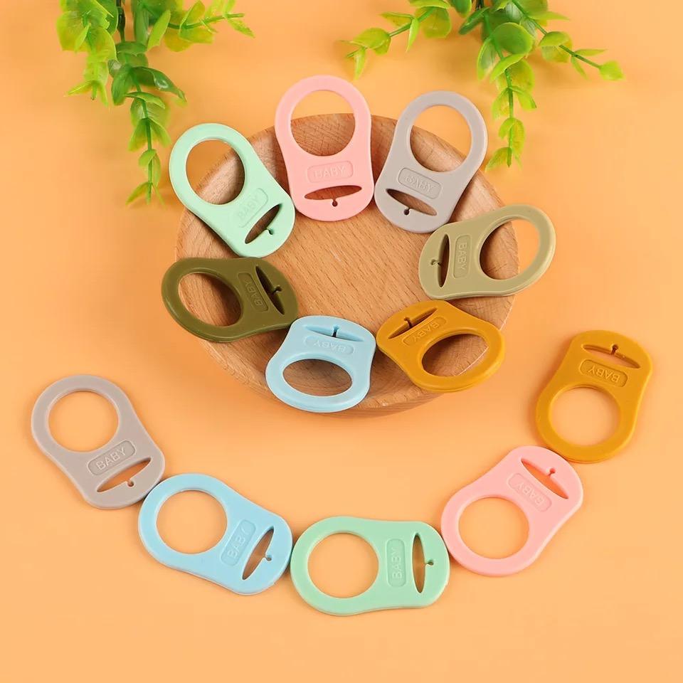 Clip adaptador de chupetas em silicone